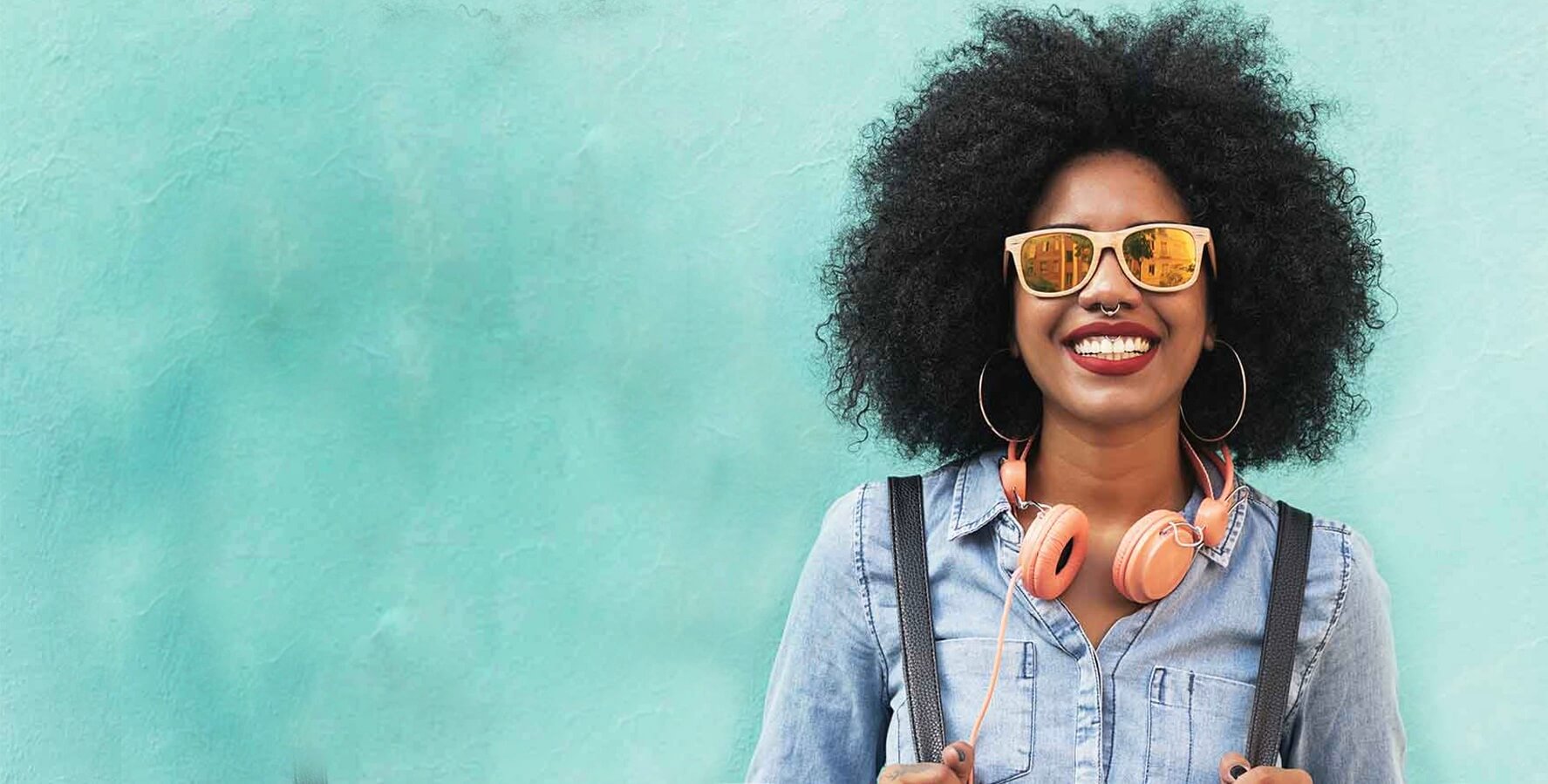 woman in sunglasses with headphones